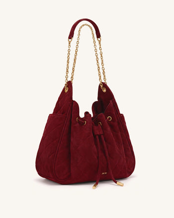 Rowan Sac seau matelassé à chaîne en faux suède - Rouge foncé