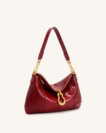 Jayla Sac à bandoulière orné d'un pendentif métallique - Rouge effet croco