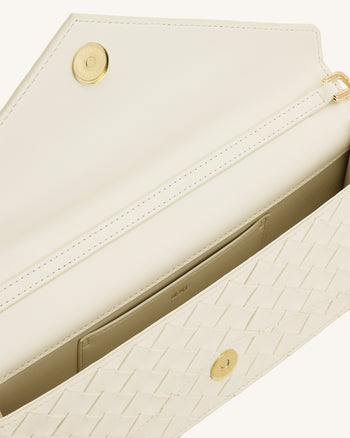 Celeste Sac à main enveloppe texturé tressé - Ivoire