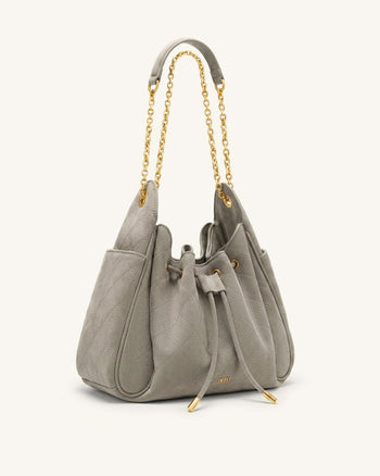Rowan Sac seau matelassé à chaîne en faux suède - Gris