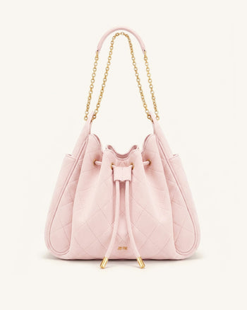 Rowan Sac seau matelassé à chaîne en faux suède - Rose