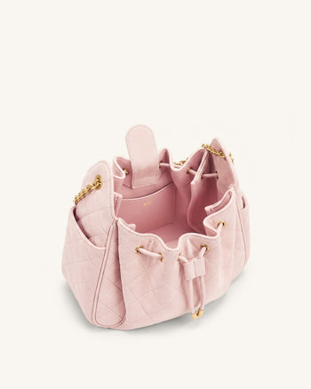 Rowan Sac seau matelassé à chaîne en faux suède - Rose
