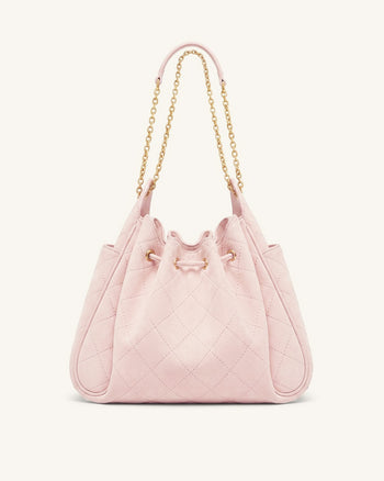 Rowan Sac seau matelassé à chaîne en faux suède - Rose