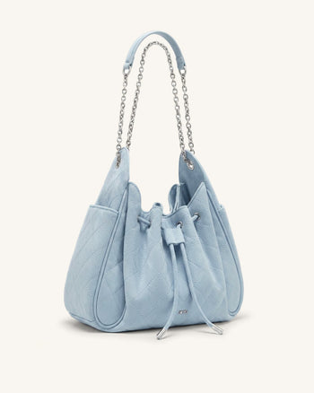 Rowan Sac seau matelassé à chaîne en faux suède - Bleu