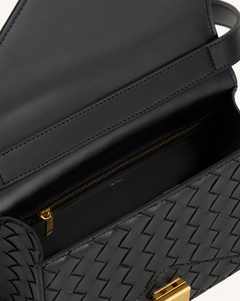 Clio Sac bandoulière enveloppe à texture tressée - Noir
