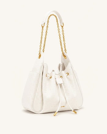 Rowan Sac seau à chaîne, cordon de serrage et détails froncés en faux cuir façon autruche - Blanc crème