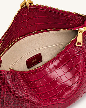Jayla Sac à bandoulière orné d'un pendentif métallique - Rouge effet croco