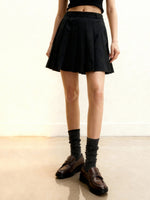 Mini-jupe plissée en satin - Noire