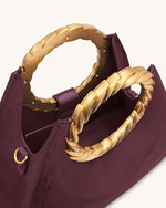 Sac sculpture en faux daim avec anse en forme de feuille Amiya - Rouge merlot