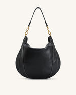 Sac à bandoulière orné d'un pendentif métallique Daria - Noir