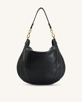 Sac à bandoulière orné d'un pendentif métallique Daria - Noir