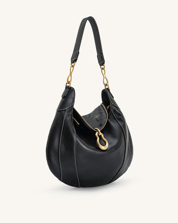 Sac à bandoulière orné d'un pendentif métallique Daria - Noir