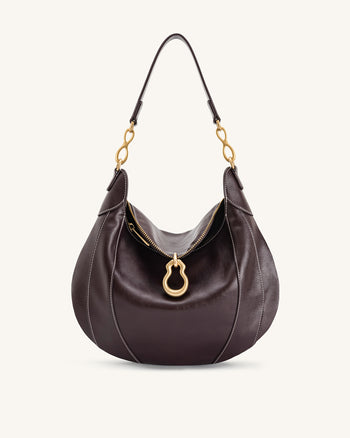 Sac à bandoulière orné d'un pendentif métallique Daria - Marron foncé