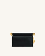 Pochette Holly ornée d'un pendentif en métal - Noir