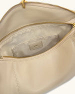 Sac bandoulière Jayla orné d’un pendentif en métal – Kaki