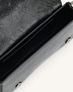 Le sac à bandoulière écrasé Joy - Noir