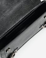 Le sac à bandoulière écrasé Sia - Noir